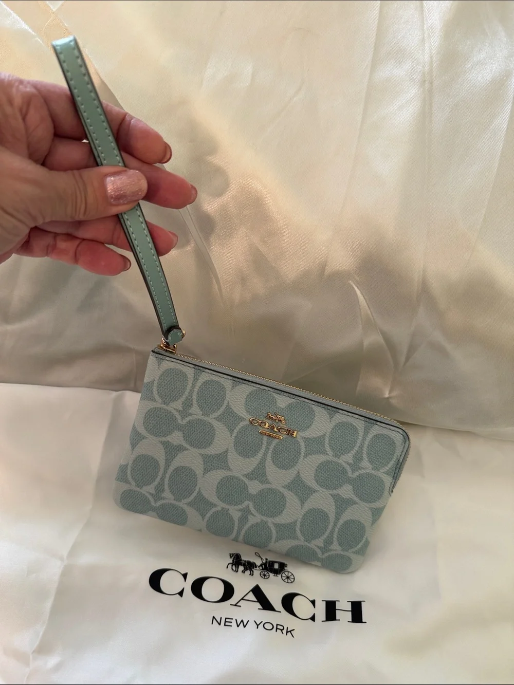 Coach wristlet featuring